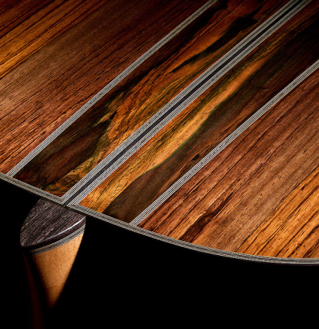 The heel, back binding and purfling of a 2025 Ariel Ameijenda "70th Anniversary - Lightning Strikes" classical guitar made of cedar and CSA rosewood