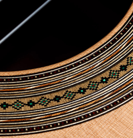 Detailed close-up of the rosette of a 2025 Ariel Ameijenda "70th Anniversary - Lightning Strikes" classical guitar made of cedar and CSA rosewood