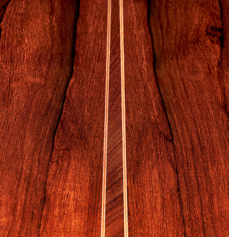 A close-up of the back of a 2022 Mario Aracama classical guitar made of spruce and African rosewood