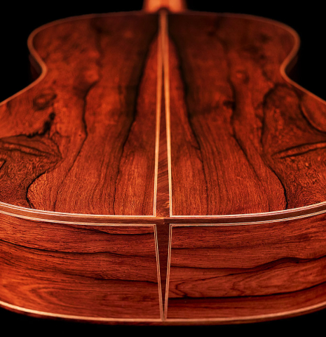 The soundboard and rosette of a 2022 Mario Aracama classical guitar made of spruce and African rosewood