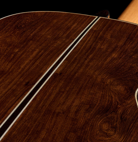 The central wedge in the back of a 2026 Mario Aracama classical guitar made of spruce and African rosewood