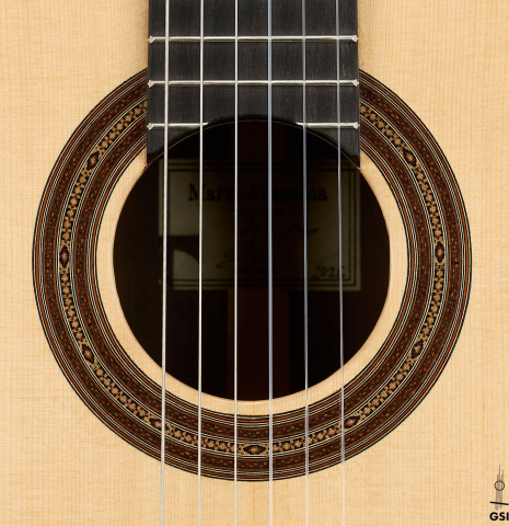 The rosette of a 2026 Mario Aracama classical guitar made of spruce and African rosewood