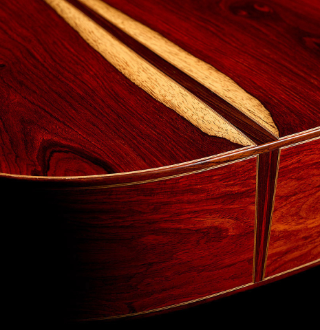The back and sides at the foot of a 2025 Mario Aracama classical guitar made of cedar and cocobolo
