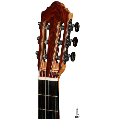 The headstock of a 2025 Mario Aracama classical guitar made of cedar and cocobolo