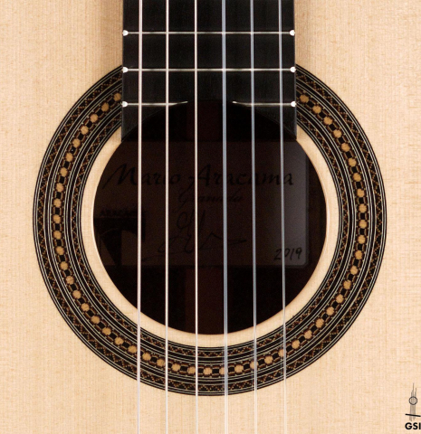 The rosette of a 2019 Mario Aracama classical guitar made of spruce and exotic Kamagong