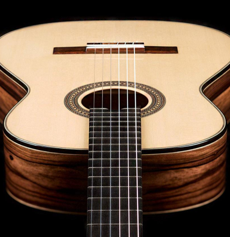 The soundboard of a 2019 Mario Aracama classical guitar made of spruce and exotic Kamagong