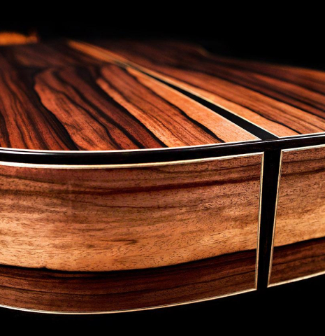 The back and sides at the foot of a 2019 Mario Aracama classical guitar made of spruce and exotic Kamagong