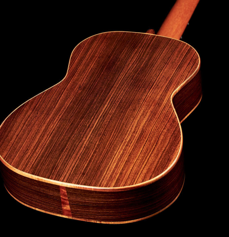 The back and sides of a 2019 Kevin Aram "Emily" classical guitar made of spruce and Indian rosewood