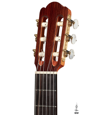 The headstock of a 2019 Kevin Aram "Emily" classical guitar made of spruce and Indian rosewood