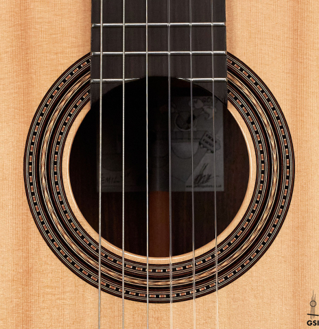The rosette of a 2019 Kevin Aram "Emily" classical guitar made of spruce and Indian rosewood