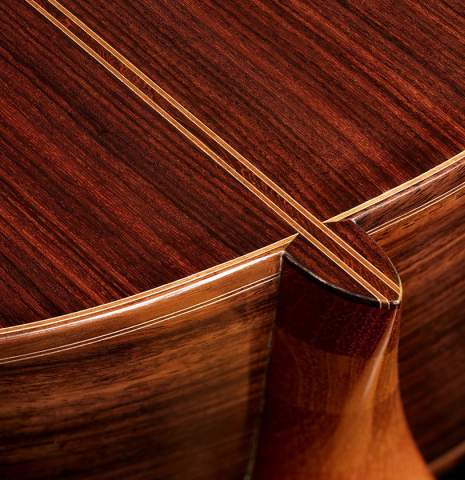 The heel, back binding and purfling of a 2025 Mario Aracama classical guitar made of spruce and Indian rosewood