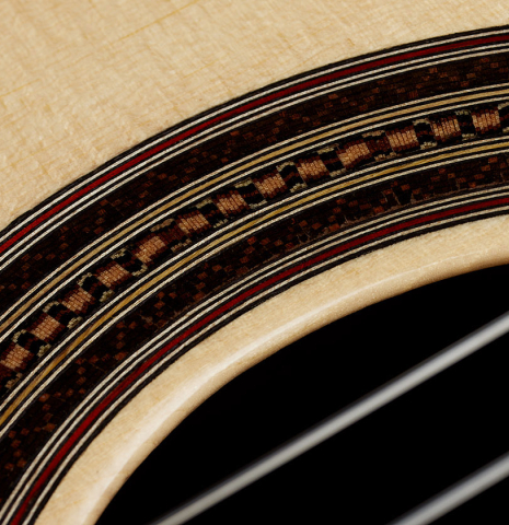Close-up detail of the rosette of a 2025 Mario Aracama classical guitar made of spruce and Indian rosewood