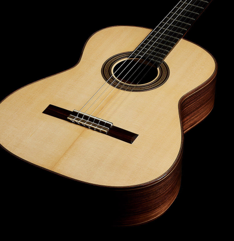 The soundboard of a 2025 Mario Aracama classical guitar made of spruce and Indian rosewood