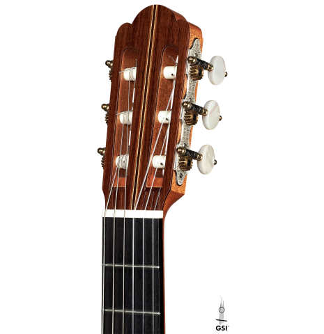 The headstock of a 1999 Kevin Aram "Marina" classical guitar made with spruce and Indian rosewood.