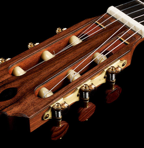 The headstock and tuning machines of a 2024 Mario Aracama classical guitar made of cedar and Kamagong