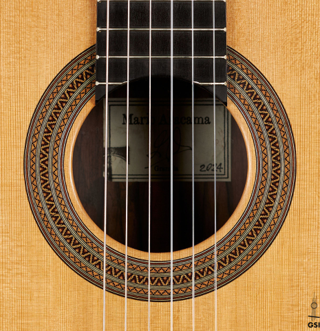 The rosette of a 2024 Mario Aracama classical guitar made of cedar and Kamagong