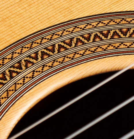 Detail of the rosette of a 2024 Mario Aracama classical guitar made of cedar and Kamagong