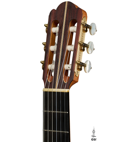 The headstock of a 2021 Kevin Aram "Nancy" classical guitar made of spruce and satinwood