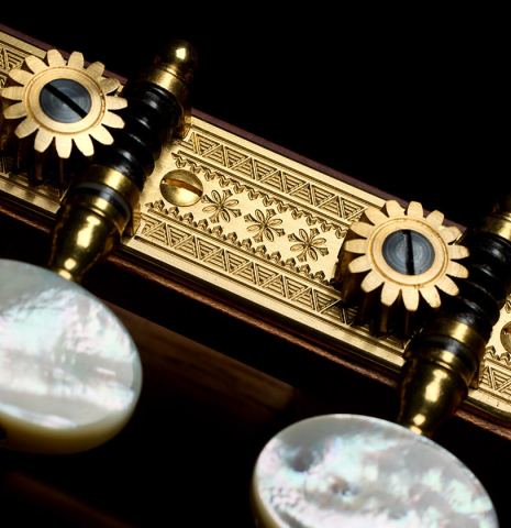 The Rodgers tuning machines of a 2021 Kevin Aram "Nancy" classical guitar made of spruce and satinwood