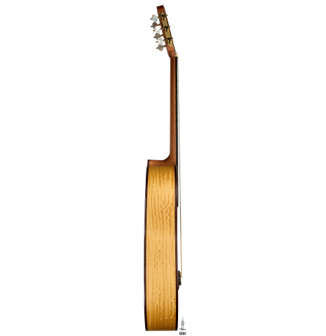 The side of a 2021 Kevin Aram "Nancy" classical guitar made of spruce and satinwood