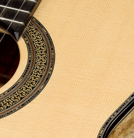 The soundboard and rosette of a 2025 Mario Aracama classical guitar made of spruce and Tamarind