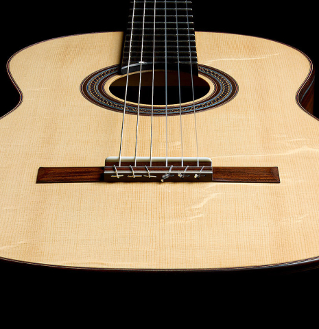 The soundboard and sides of a 2025 Manuel Arango classical guitar made of spruce and Indian rosewood