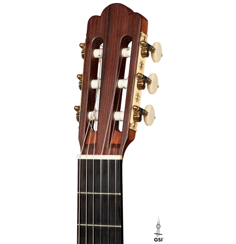 The headstock of a 1903 Vicente Arias classical guitar made with spruce and CSA rosewood on a white background