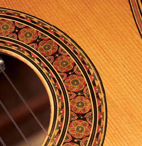Closeup of the rosette of a 1903 Vicente Arias classical guitar made with spruce and CSA rosewoodThe label of a 1903 Vicente Arias classical guitar made with spruce and CSA rosewood