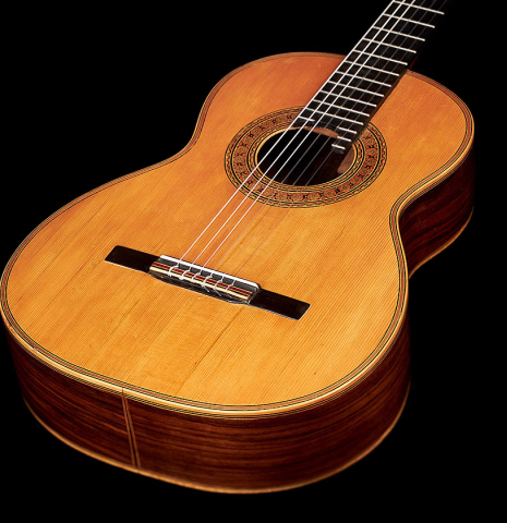 The soundboard and sides of a 1903 Vicente Arias classical guitar made with spruce and CSA rosewood