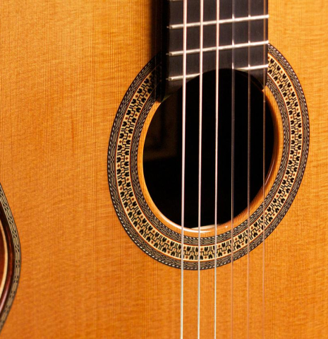 The soundboard and rosette of an Asturias &quot;Custom C&quot; a 640 mm scale classical guitar made of cedar and Indian rosewood