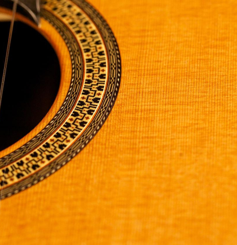 The soundboard and rosette of an Asturias &quot;Custom C&quot; a 640 mm scale classical guitar made of cedar and Indian rosewood