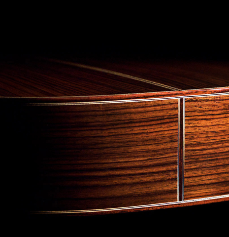 The side of an Asturias "Custom S" classical guitar made of spruce and Indian rosewood
