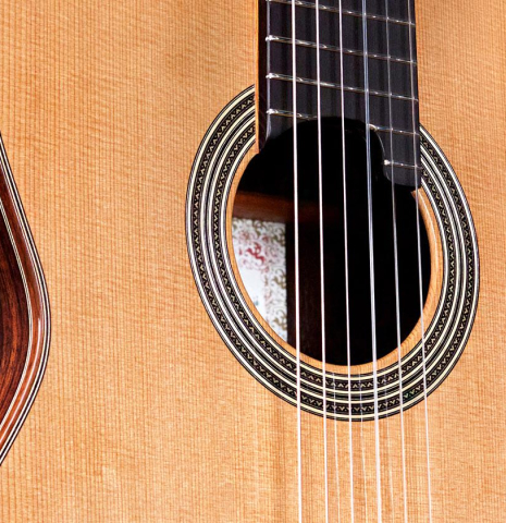 The soundboard and side of a 2022 Asturias &quot;Double Top&quot; classical guitar made of cedar and Indian rosewood