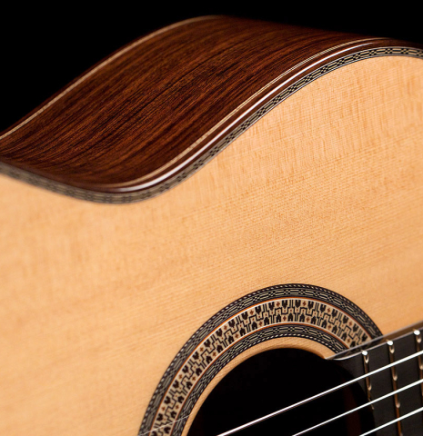 The soundboard, rosette and purfling of a 2022 Asturias &quot;Custom C&quot; classical guitar made with 630 mm scale