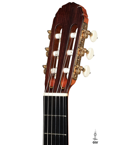 The headstock of a 2014 Angel Benito Aguado classical guitar made of cedar and Indian rosewood.