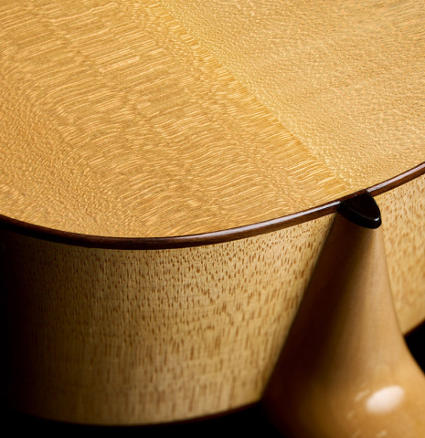 The heel, back binding and purfling of a 2011 Angel Benito Aguado "Romantic" classical guitar made of spruce and maple