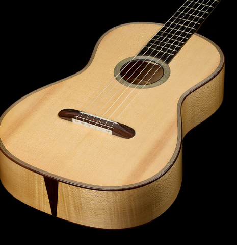 The soundboard of a 2011 Angel Benito Aguado "Romantic" classical guitar made of spruce and maple
