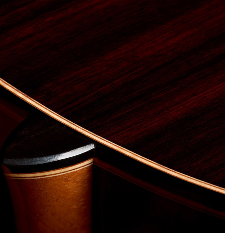 The heel, back binding and purfing of a 2026 Francesco Baccaglion classical guitar made of spruce and Indian rosewood