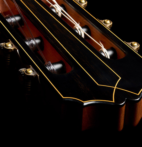 The Santos inspired headstock shape with inlaid purflings of a 2026 Francesco Baccaglion classical guitar made of spruce and Indian rosewood
