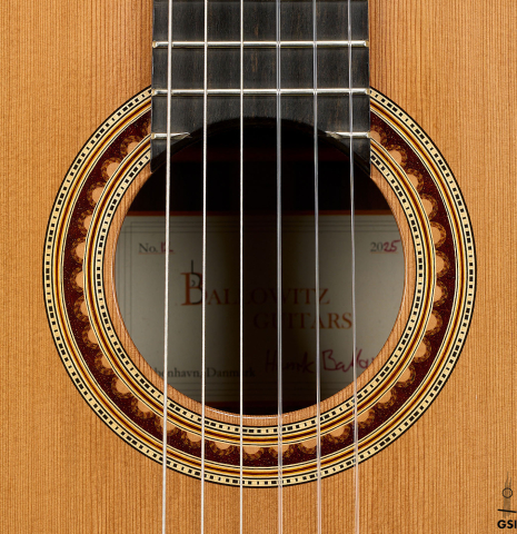 The rosette of a 2025 Henrik Ballowitz classical guitar made of cedar and African Blackwood
