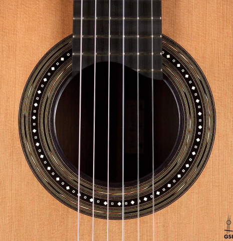 The rosette of a 2020 Kris Barnett classical guitar made with cedar and African rosewood