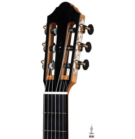 The headstock and tuners of a 2020 Kris Barnett classical guitar made with cedar and African rosewood