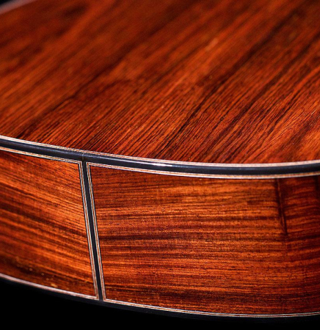 The back and sides of a 2020 Kris Barnett classical guitar made with cedar and African rosewood