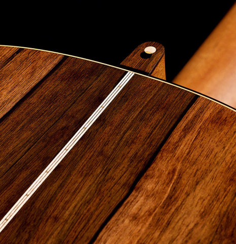 The heel and back of a 2022 Marco Bortolozzo classical guitar made with spruce and exotic ebony