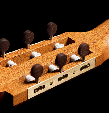 The handmade machine heads of a 2022 Marco Bortolozzo classical guitar made with spruce and exotic ebony