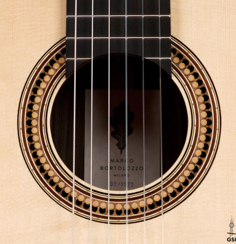 The rosette of a 2022 Marco Bortolozzo classical guitar made with spruce and exotic ebony