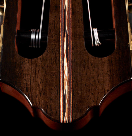 The headstock and tuners of a 2023 Kris Barnett classical guitar made with cedar and exotic ebony