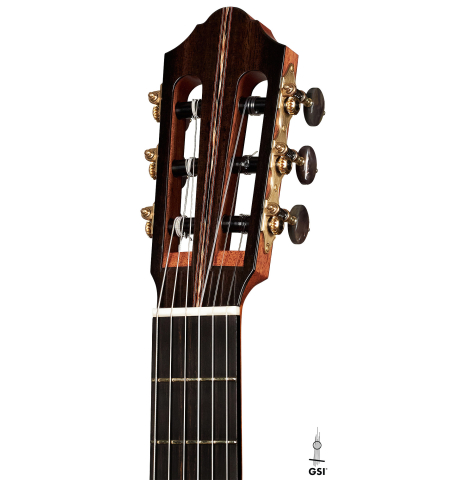 The headstock and tuners of a 2023 Kris Barnett classical guitar made with cedar and exotic ebony