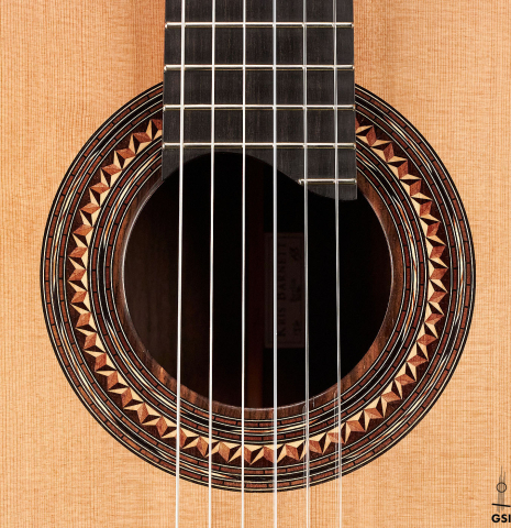 The rosette of a 2023 Kris Barnett classical guitar made with cedar and exotic ebony