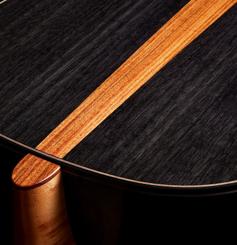 The heel, back binding and purfling of a 2025 Kris Barnett classical guitar made of cedar and exotic ebony